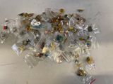 a pile of pins and other items on a table