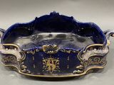 an image of a blue and gold bowl with a lion on it