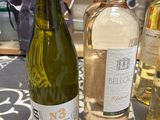 several bottles of wine are lined up on a table