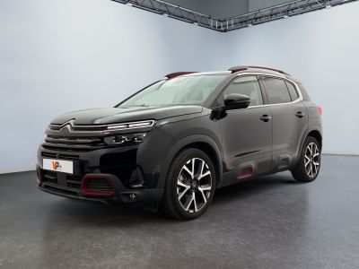 the new citrole suv is parked in a large room