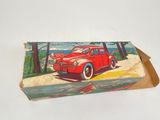 a box with a picture of a red car on it