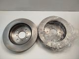 a close up of a brake disc on a white surface