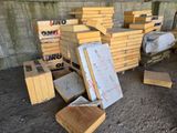 a pile of boxes sitting on the ground next to each other