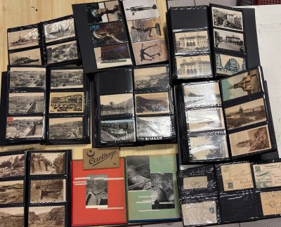 a pile of old postcards on the floor