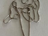 silver plated necklace with a flower pendant on a chain