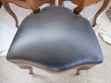 a chair that has a black seat on it