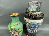two vases sitting next to each other on a table