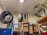 a garage with a lot of things hanging from the ceiling