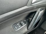 a close up of a car ' s door handle with buttons