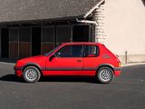 a small red car parked in front of a building