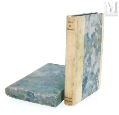two books sitting next to each other on a white surface