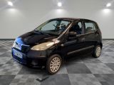 a picture of a small black car on a checkered floor