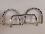 a metal rack that is on the floor next to a white wall