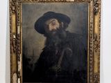 un tableau représentant un homme barbu coiffé d'un chapeau