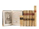 an old book set with a picture of a woman in a dress and a book with a picture of a woman in a dress