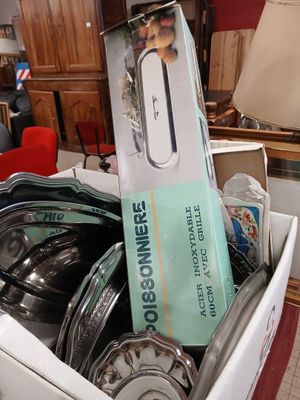 a box full of pots and pans in the kitchen