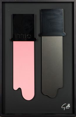 a close up of two different shades of lipstick in a black box