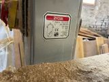 a picture of a machine that is working on wood