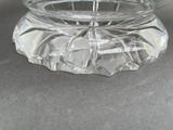 a clear glass bowl with a lid on a table