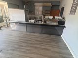 a picture of a kitchen being remodeled with new flooring