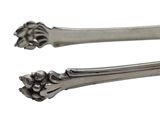 two spoons that are sitting next to each other