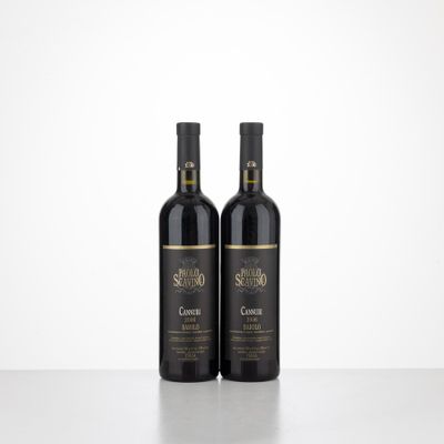 two bottles of wine sitting on top of a table next to each other