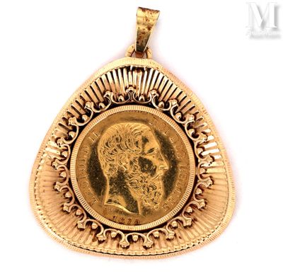 an image of a gold pendant with a portrait of a man on it