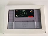 a nintendo game in a white box on a table