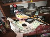 a bird that is sitting on top of a shelf