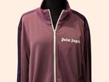 the mannequin is wearing a purple jacket with white writing on it