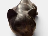 a sculpture of a bear head on a white surface