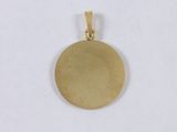 a close up of a gold pendant on a white background