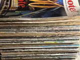 a stack of magazines sitting on a marble table