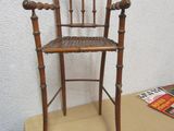a wooden chair that is sitting on a table