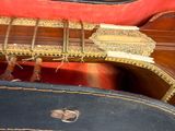a guitar inside of a case with a guitar in it