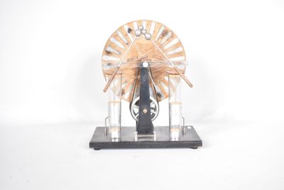 a small model of a spinning wheel on a stand