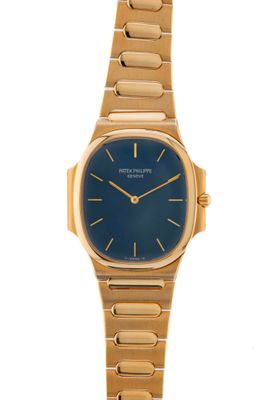 a close up of a gold wrist watch on a white background