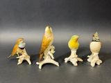 cinq figurines d'oiseaux empilées les unes sur les autres