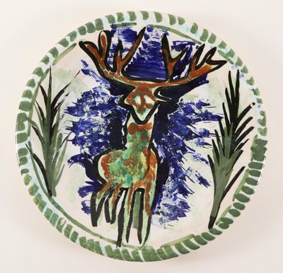 a picture of a decorative plate with a deer on it