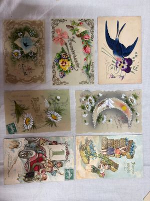 a lot of cards with birds and flowers on them