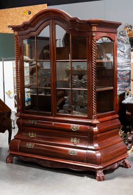 a display case with a piano and a piano in the background