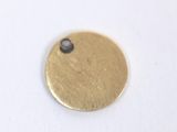a close up of a metal disc with a hole in the middle