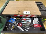 a drawer full of assorted tools in a warehouse