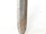 a large knife that is sitting on a white surface