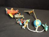 a lot of toys that are sitting on a black surface