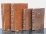 three books that are sitting on a table