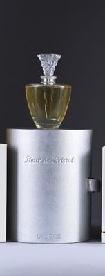 bottles of perfume sitting on top of a table next to each other