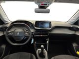 the interior of a small car with a steering wheel and dashboard