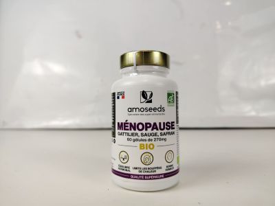 un gros plan d'un flacon de « Menopaaise » posé sur une table