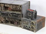 an old radio sitting on top of a table next to a box